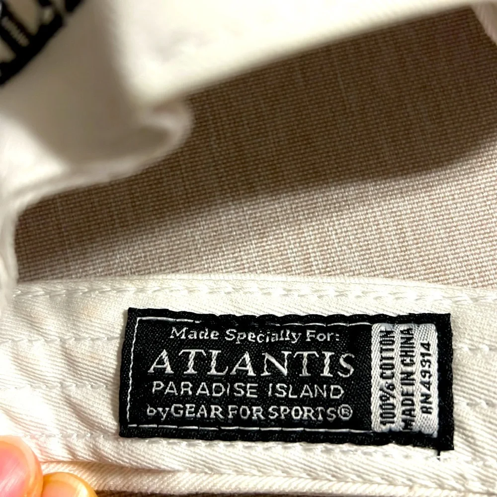 Atlantis. Paradise Island. White Atlantis Visor Hat. NWOT. One size fits all.